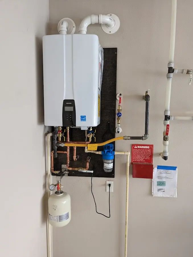 Professional plumber installing copper piping in a Miami Beach home